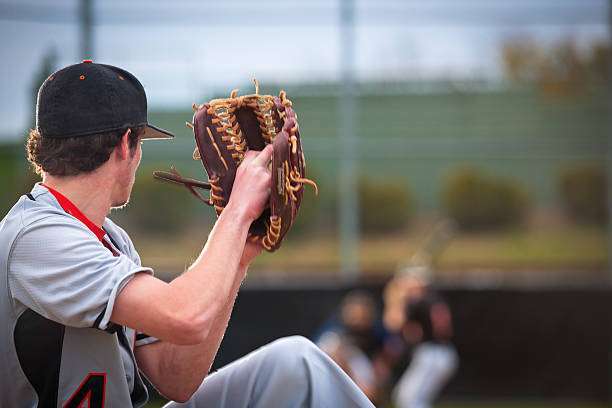 Using a baseball glove in the game