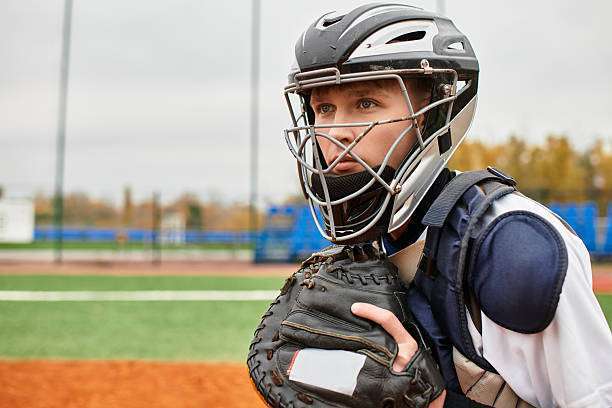 The teenager gripped the baseball glove tightly.