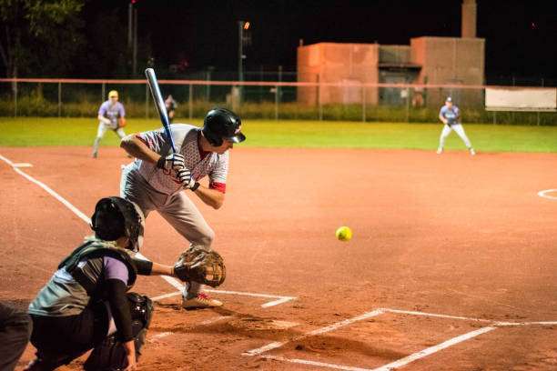 Softball Hitter and Catcher Waiting for Ball.baseball glove