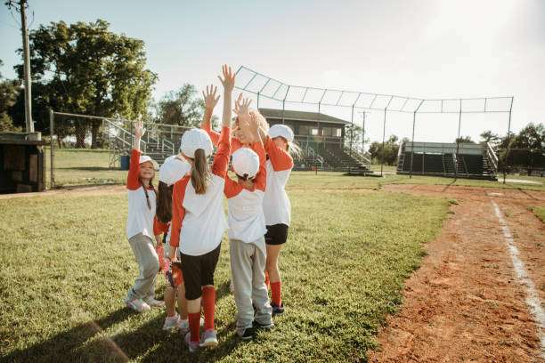 Team celebrates around a baseball glove.