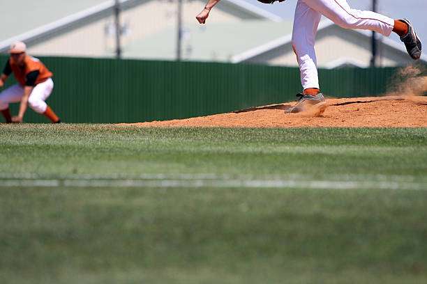 Pitcher delivers a fastball on the mound; every player needs a baseball glove.