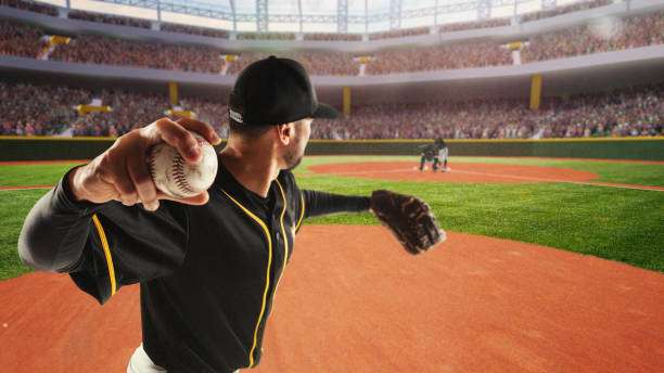 Pitcher on mound, ball in hand, wearing a baseball glove in a crowded stadium.