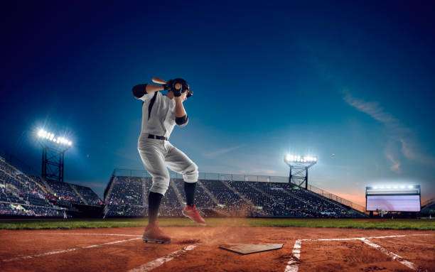 Person swinging a bat at a baseball on a sunny field, ready for their baseball glove.